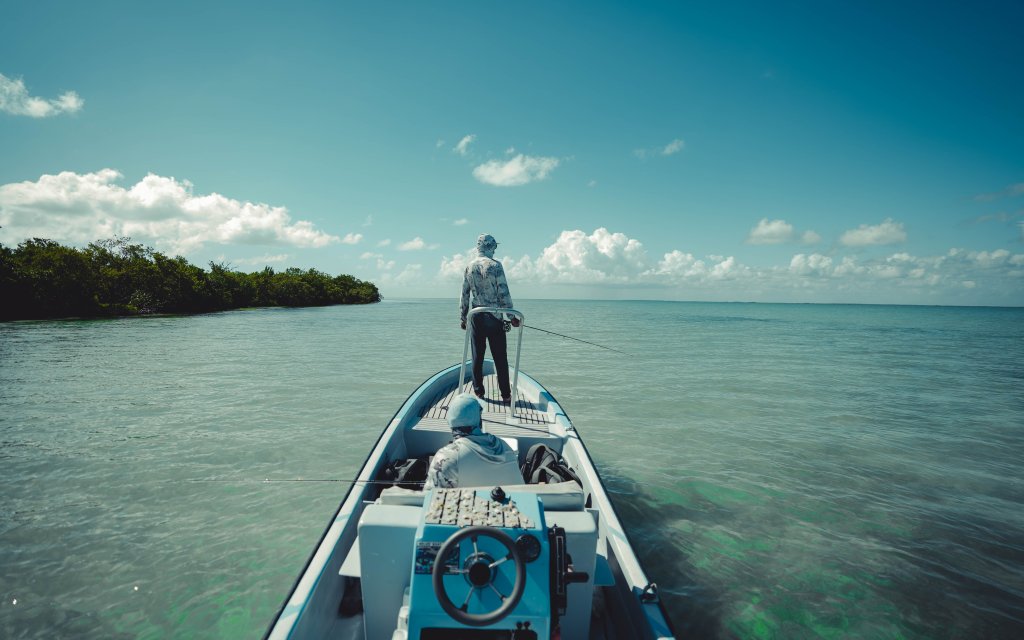 An angler scanning the water for permit